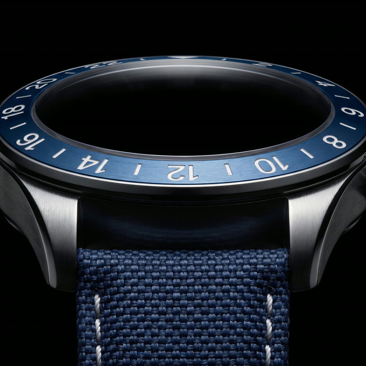 The 24-hour GMT bezel of The Navigator above the canvas strap